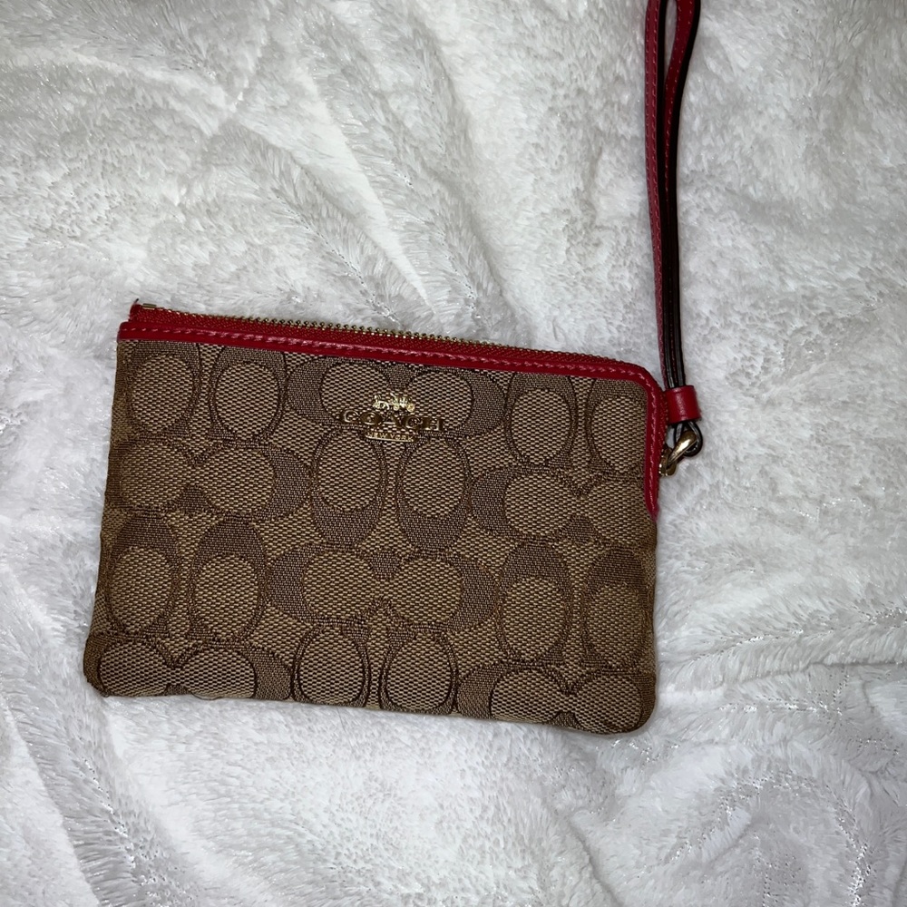 Coach Wrist wallet. So cute and trendy. Brown and Red. Good condition.